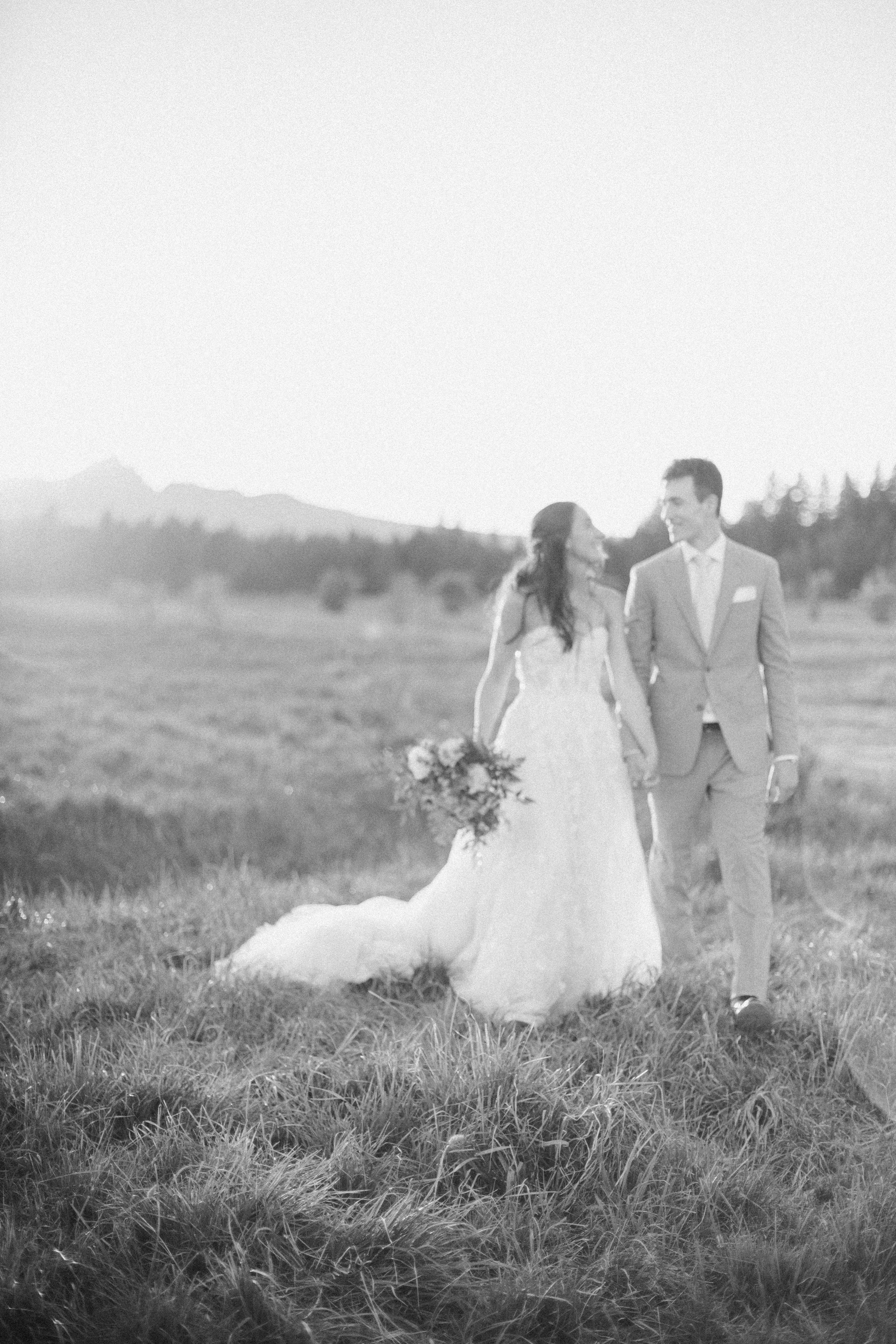 Sisters, Black Butte, Oregon Wedding with sunset pictures featuring the cascade mountains in background. Dreamy & airy, soft focus image. Local to Redmond & the Central Oregon region.